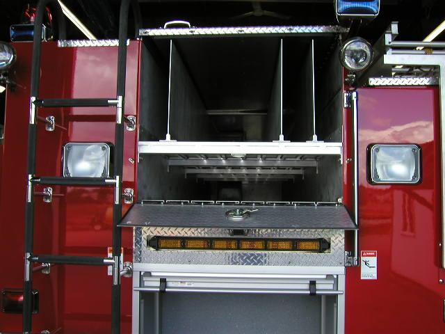 Ladder storage under hosebed